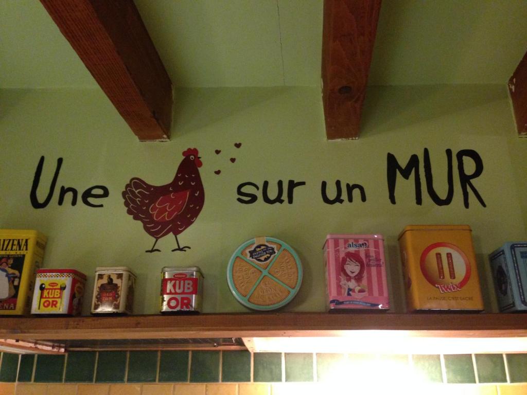 a sign on a shelf with a chicken on it at La Grange in Durban-Corbières