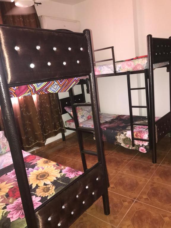 Postel nebo postele na pokoji v ubytování Sami Hostel
