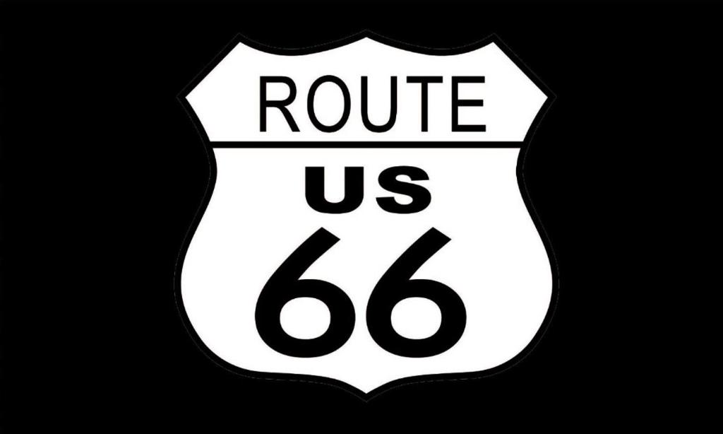a white and black sign that reads route us at Economy Inn Barstow in Barstow