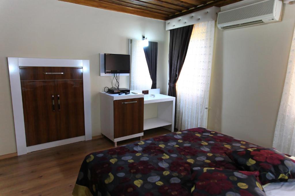 Postel nebo postele na pokoji v ubytování Bacchus Pension