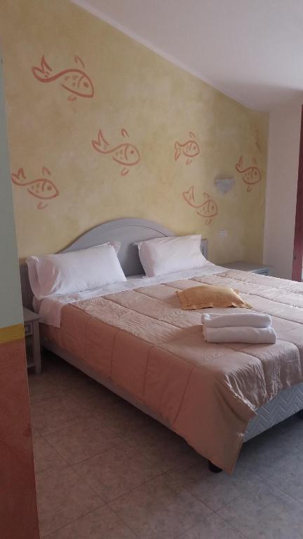 Postel nebo postele na pokoji v ubytování Hotel Jasmine