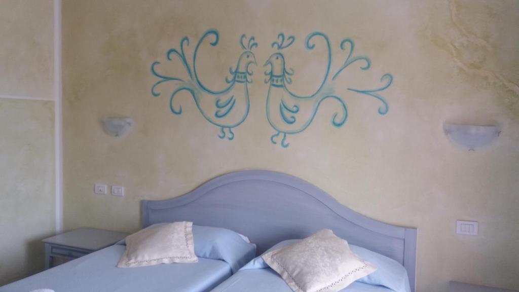Postel nebo postele na pokoji v ubytování Hotel Jasmine