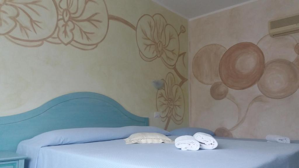 Postel nebo postele na pokoji v ubytování Hotel Jasmine