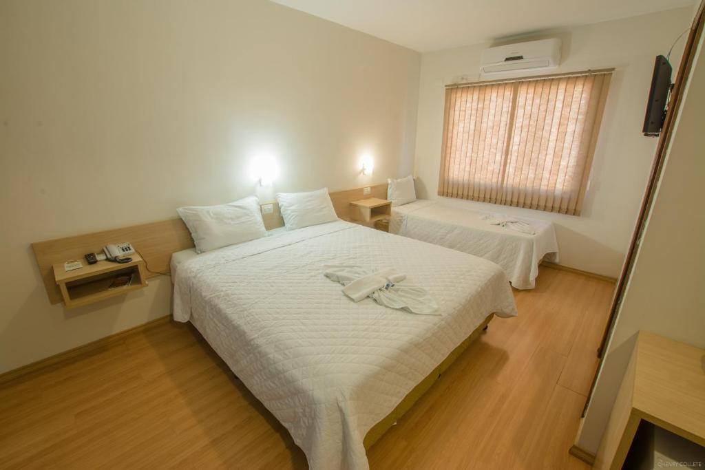 Postel nebo postele na pokoji v ubytování Hotel Dom Thomaz