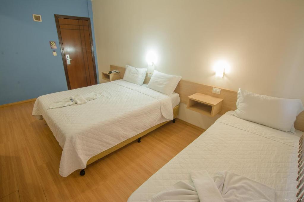 Postel nebo postele na pokoji v ubytování Hotel Dom Thomaz