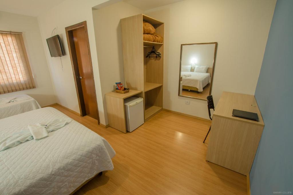 Postel nebo postele na pokoji v ubytování Hotel Dom Thomaz