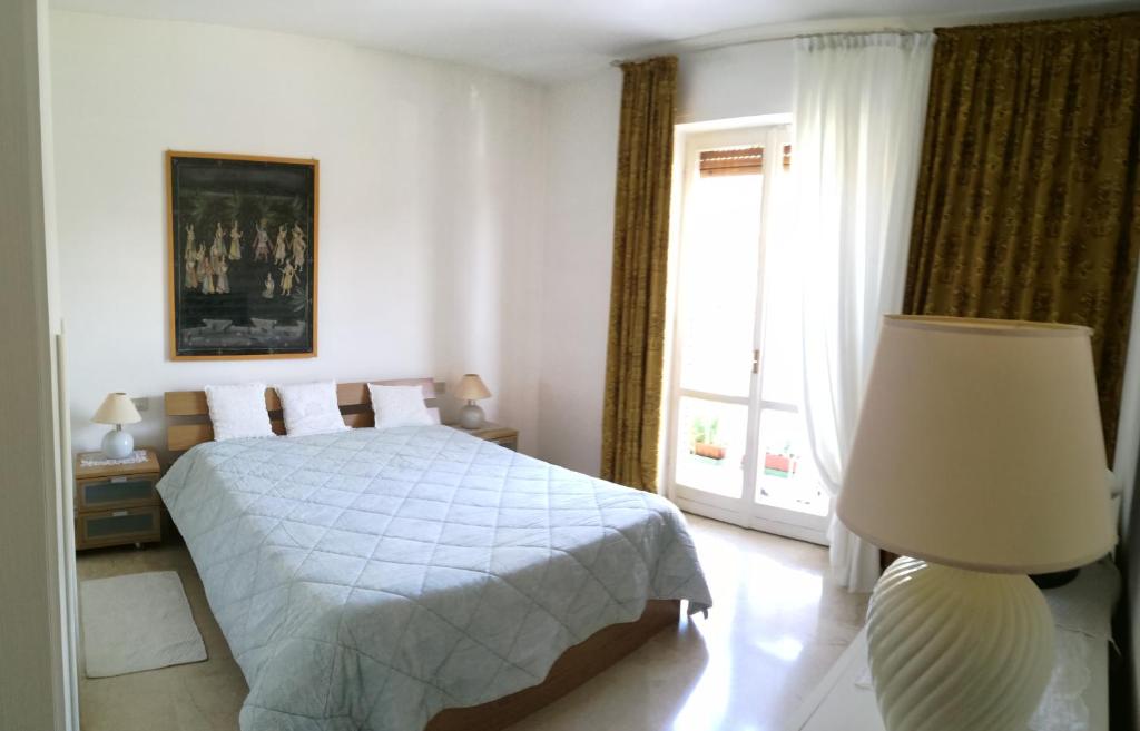 Ένα ή περισσότερα κρεβάτια σε δωμάτιο στο Casa Vacanze Dorotina