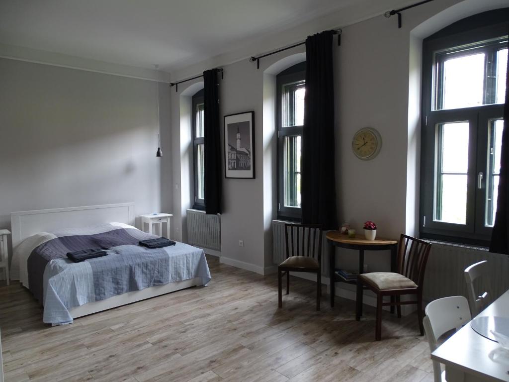 Posteľ alebo postele v izbe v ubytovaní Óváros Apartman