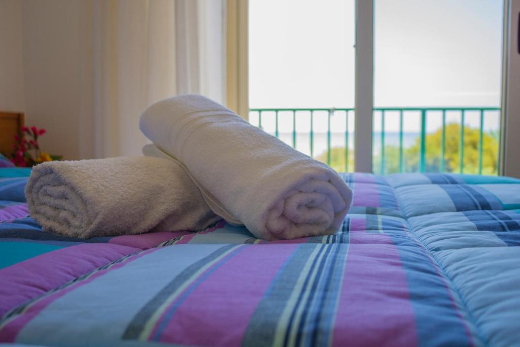 Postel nebo postele na pokoji v ubytování Punta Di Mola