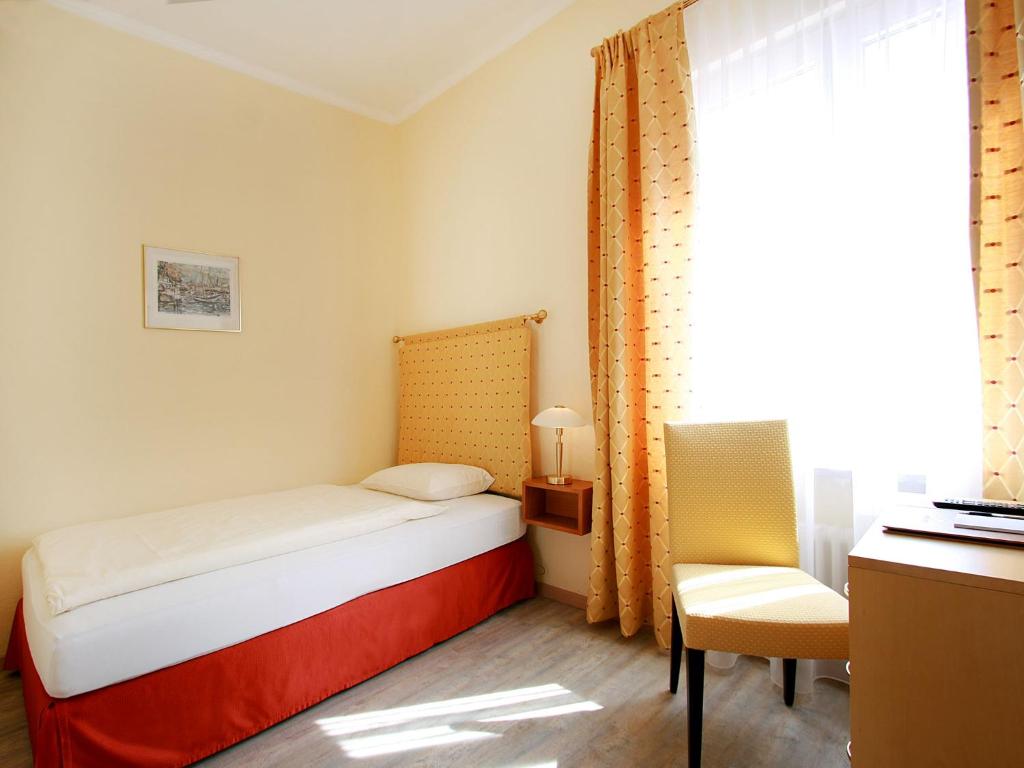 Una cama o camas en una habitación de Hotel Garni Golf