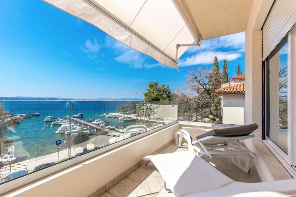 a balcony with a view of the ocean at Apartments Sax in Crikvenica