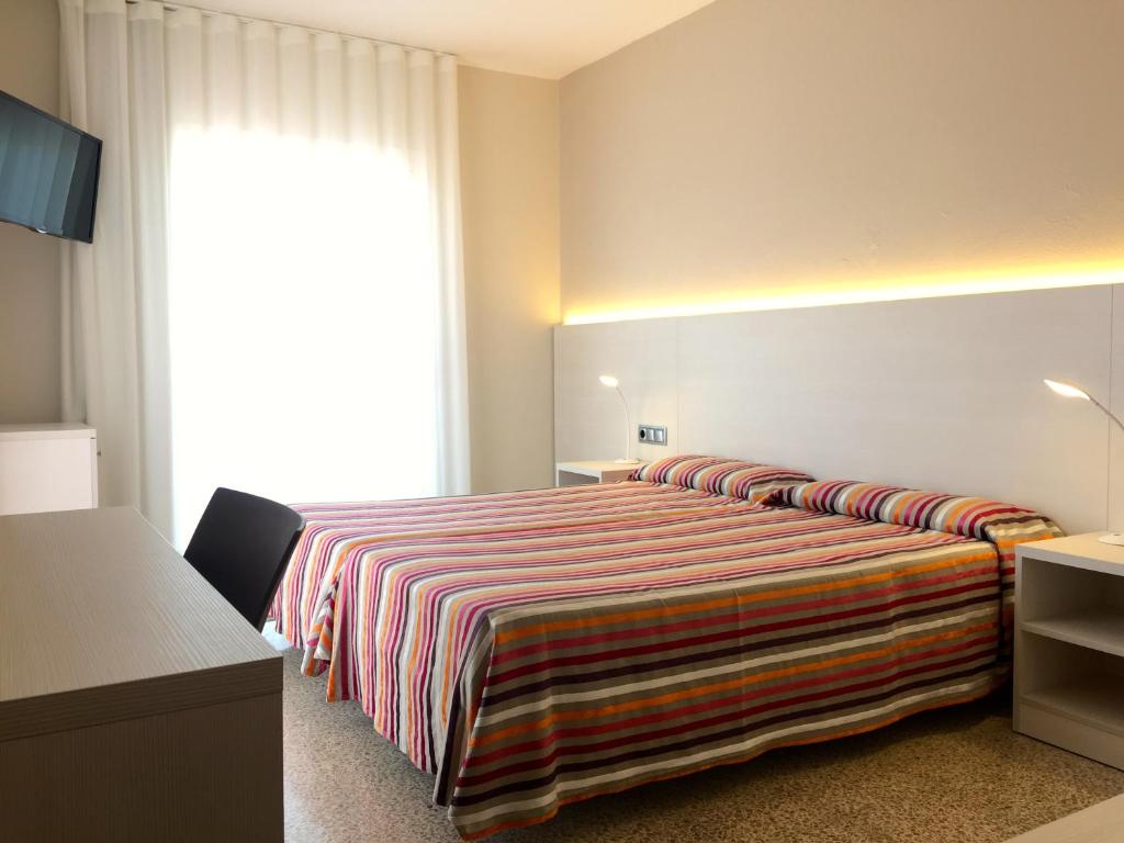 Postel nebo postele na pokoji v ubytování Hotel Nereida