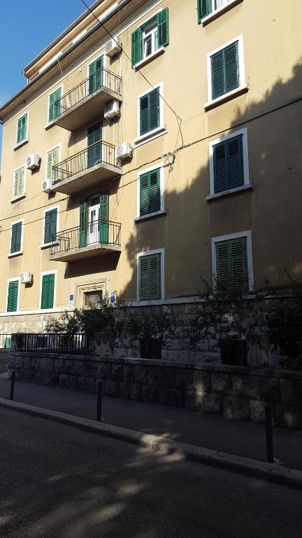 a large building with balconies on the side of it at Apartment Lelli in Split