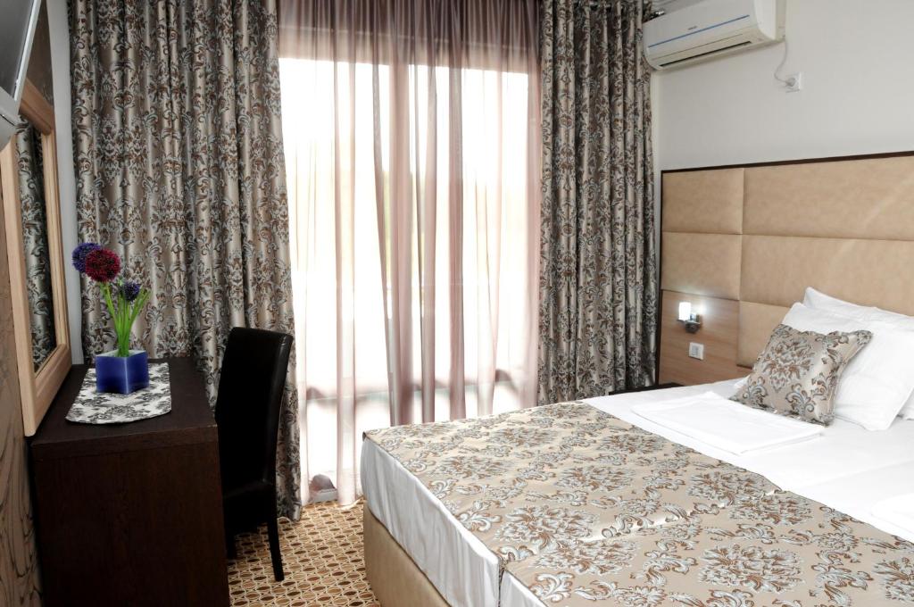 Postel nebo postele na pokoji v ubytování Hotel Lion