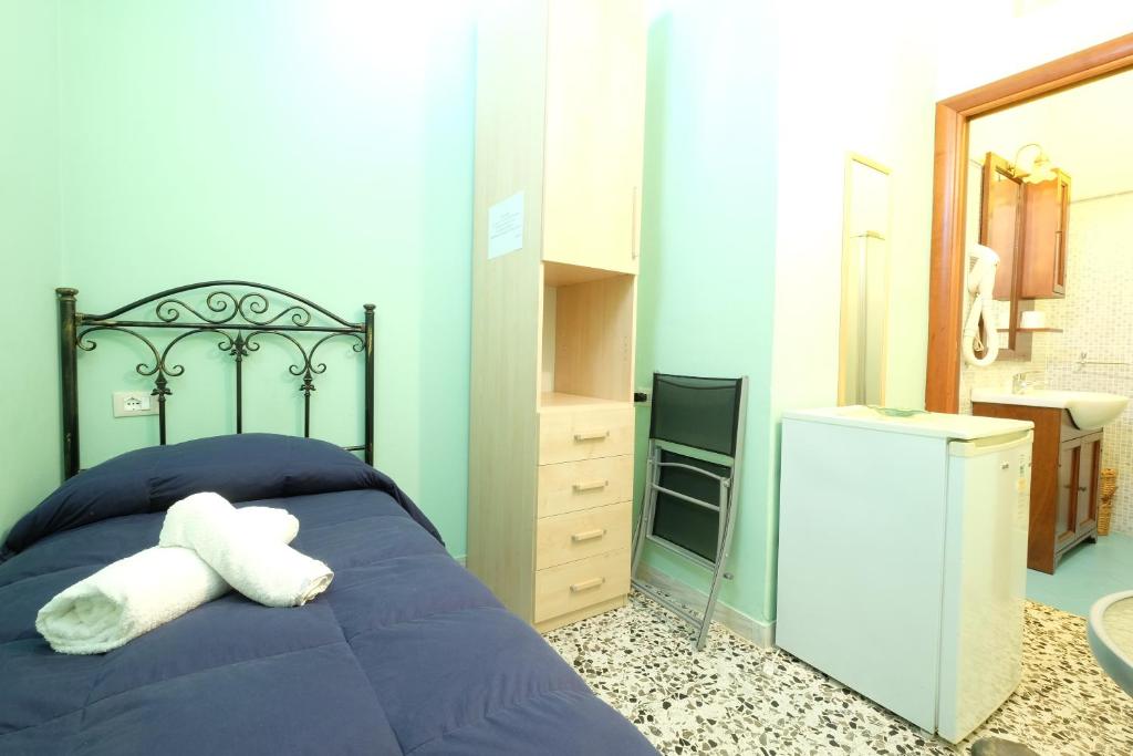 Posteľ alebo postele v izbe v ubytovaní Corte Coronisio B&b