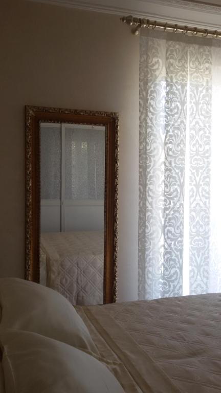 A bed or beds in a room at Daphnae House