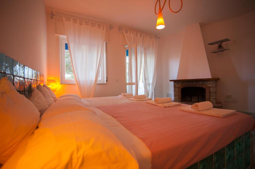 Postel nebo postele na pokoji v ubytování Suite House L'Isola Che Non C'è