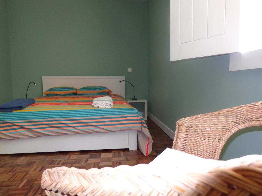 Postel nebo postele na pokoji v ubytování Ribeira Apartment