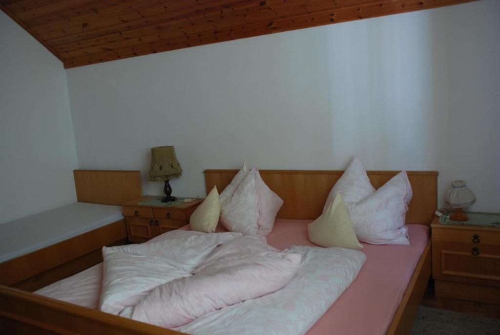 Postel nebo postele na pokoji v ubytování Haus Grundner