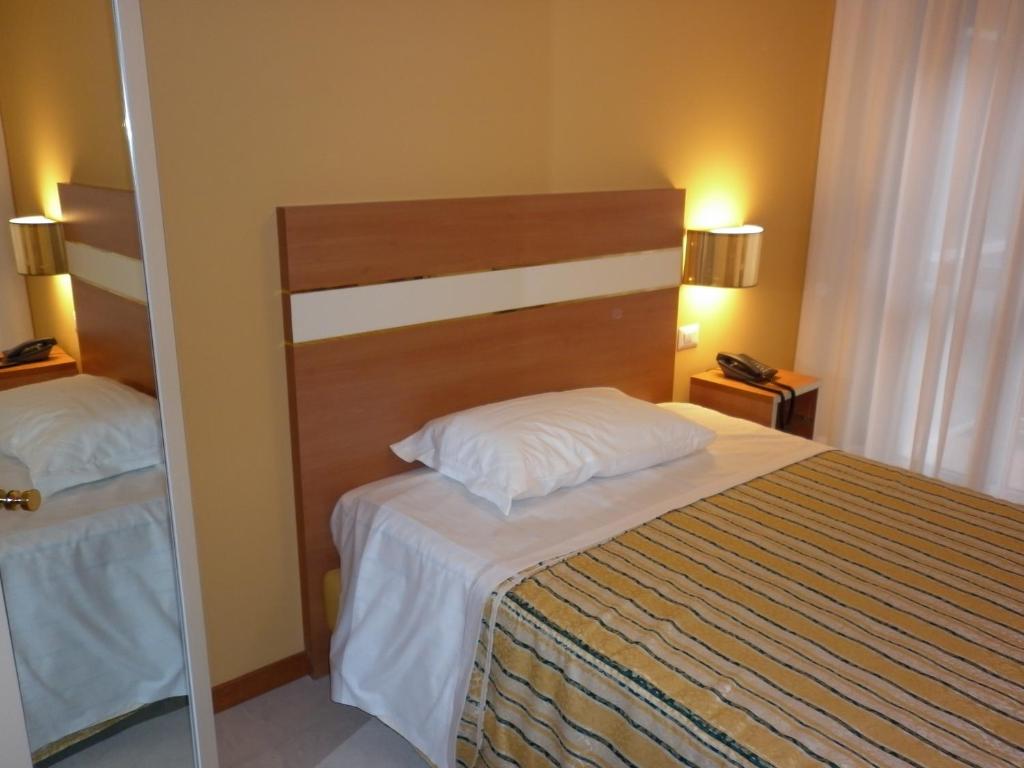 Postel nebo postele na pokoji v ubytování Hotel GF