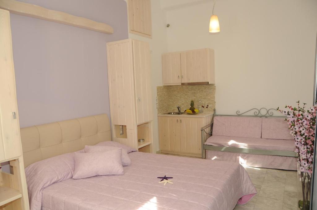 Posteľ alebo postele v izbe v ubytovaní Starlight Luxury Studios