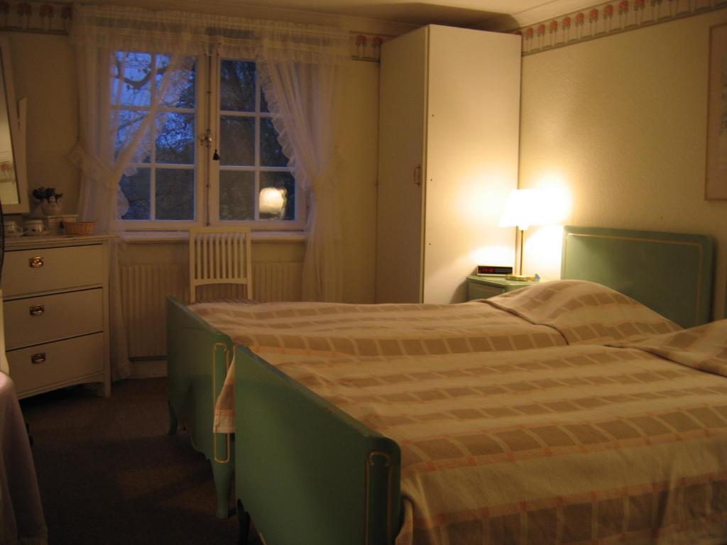 Postel nebo postele na pokoji v ubytování Forsbacka Wärdshus