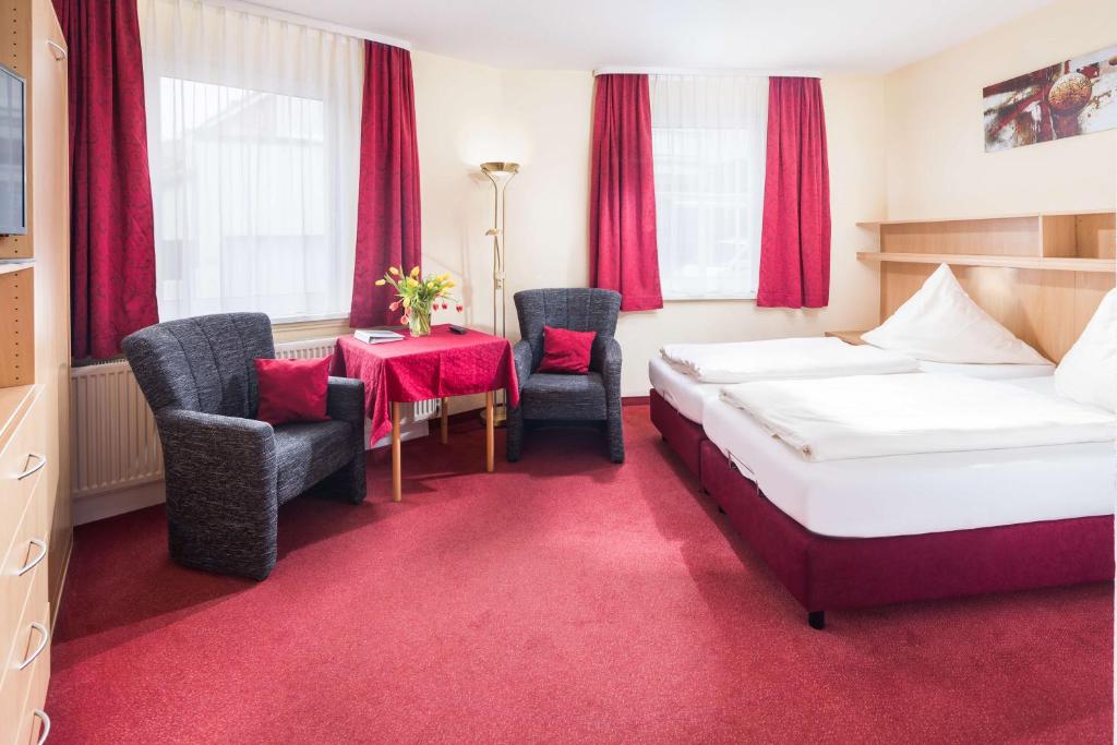 Postel nebo postele na pokoji v ubytování Gästehaus Bakker