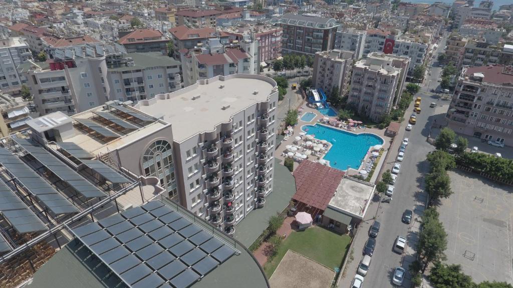 an aerial view of a building with a pool at Club Sidar Apart Hotel in Alanya