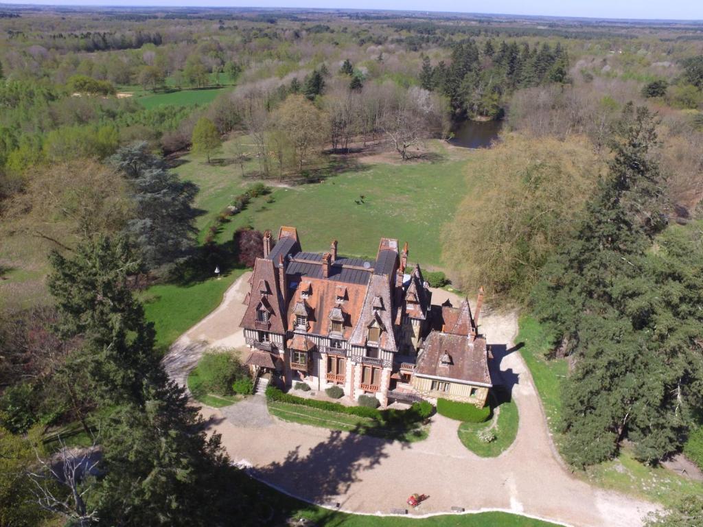 an aerial view of a large house in a field at château Mont Suzey in Yvoy-le-Marron