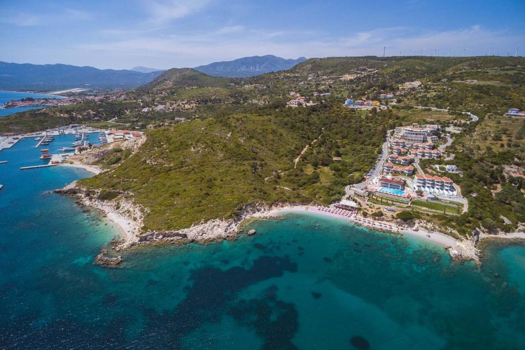 an aerial view of a beach with boats in the water at Proteas Blu Resort in Pythagoreio