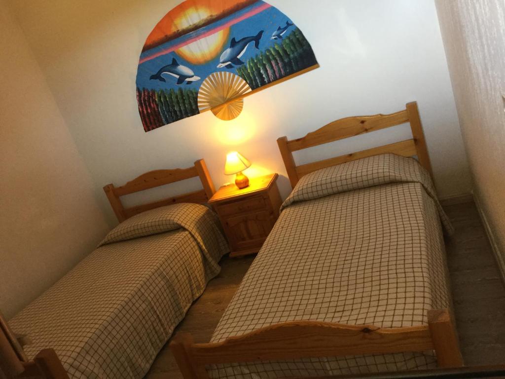 Postel nebo postele na pokoji v ubytování Résidence Playa Del'Oro