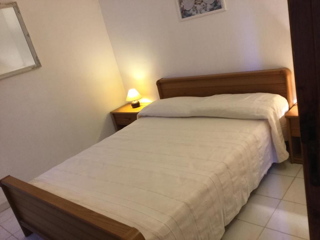 Postel nebo postele na pokoji v ubytování Résidence Playa Del'Oro