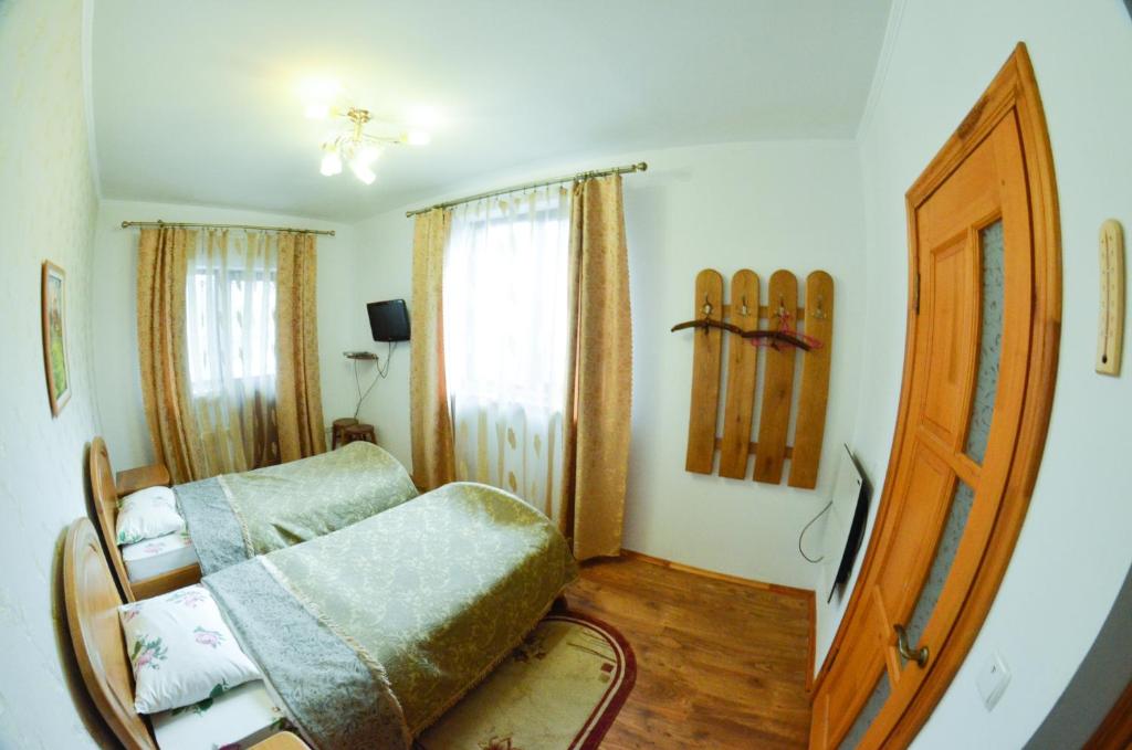 Postel nebo postele na pokoji v ubytování Hovanka
