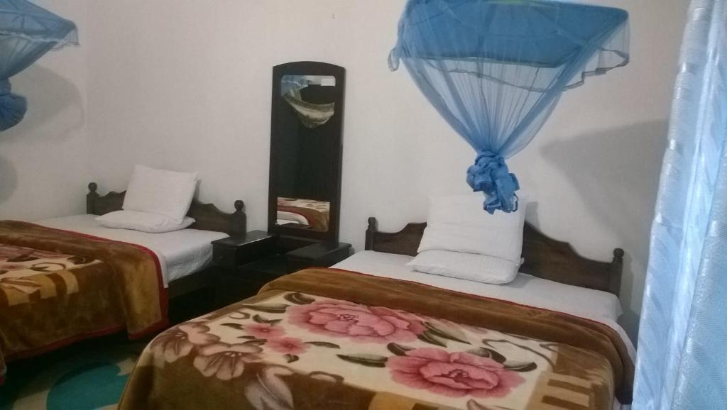Postel nebo postele na pokoji v ubytování Srihelyes Inn