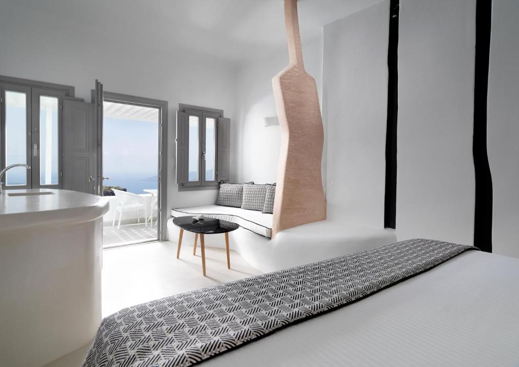 Postel nebo postele na pokoji v ubytování Tholos Resort