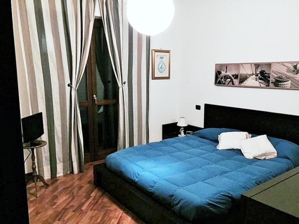 Łóżko lub łóżka w pokoju w obiekcie Domus al Parco Guest House