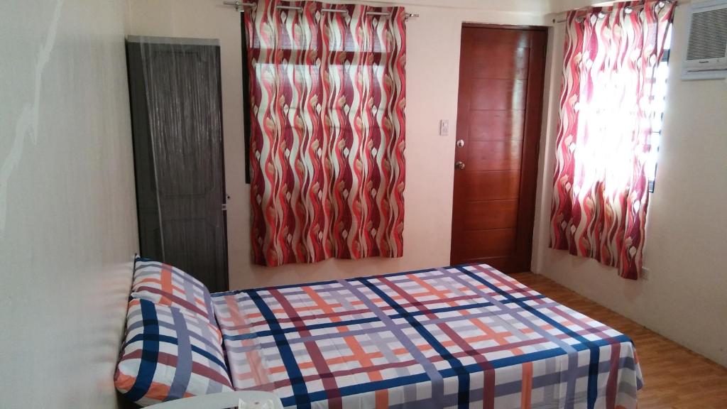 Letto o letti in una camera di Budget Studio Unit in Makati
