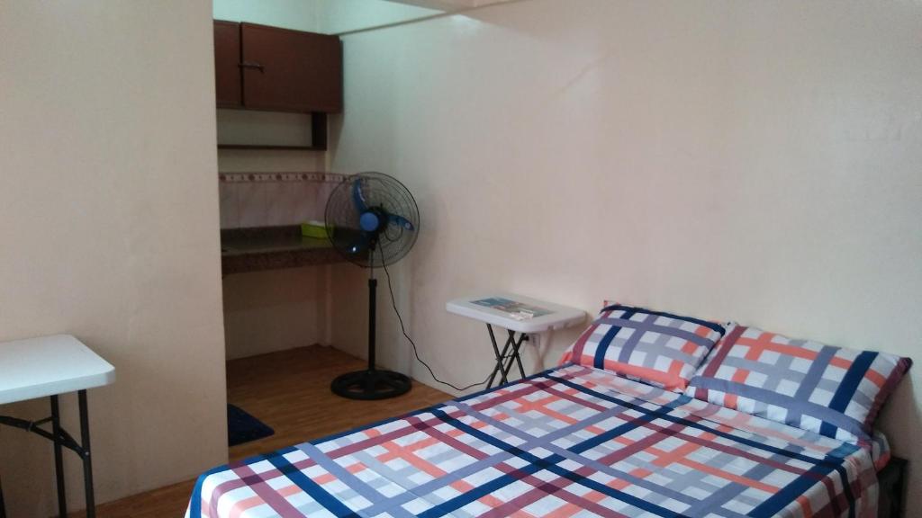 Letto o letti in una camera di Budget Studio Unit in Makati
