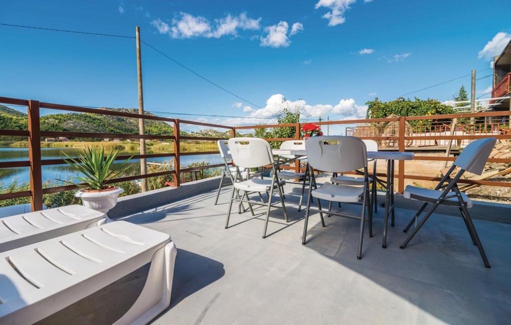 a patio with chairs and a table on a balcony at Holiday Home Paul in Blace