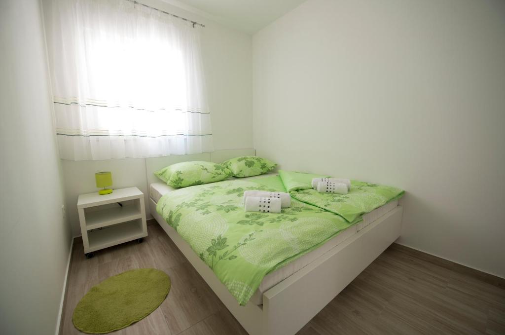Postel nebo postele na pokoji v ubytování Apartments Bonus and private parking