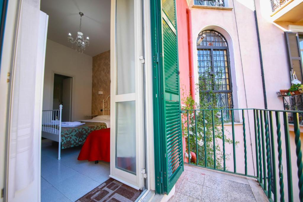 Postel nebo postele na pokoji v ubytování Hotel Pisa