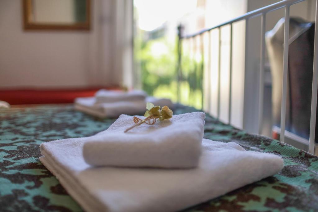 Postel nebo postele na pokoji v ubytování Hotel Pisa