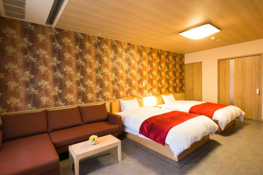 Postel nebo postele na pokoji v ubytování Sundance Resort Hakone Gora