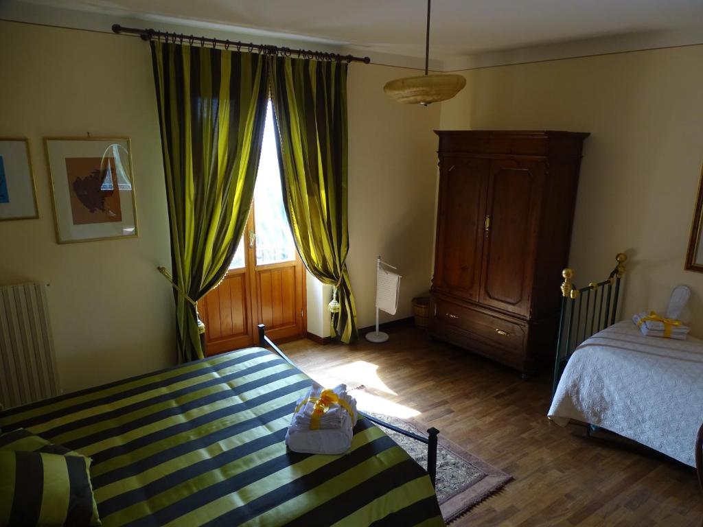 Postel nebo postele na pokoji v ubytování Arco di San Francesco