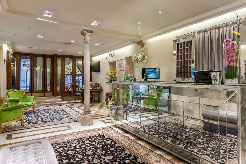 TV a/nebo společenská místnost v ubytování Hotel Ca' dei Conti