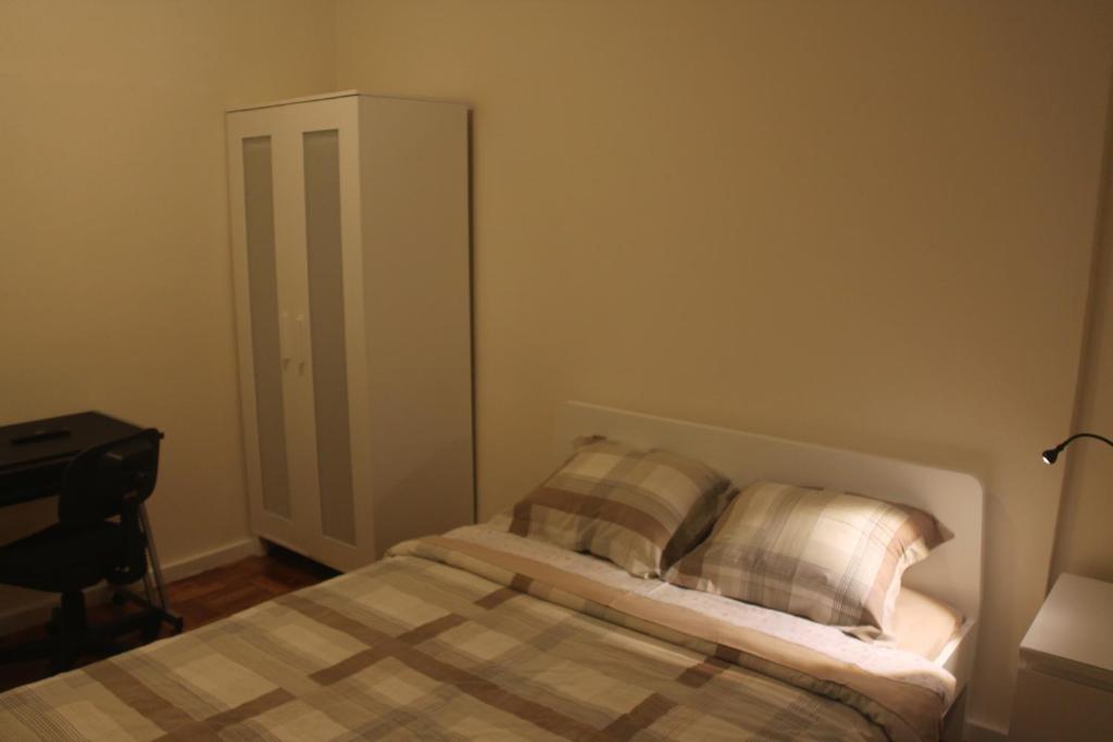 Postel nebo postele na pokoji v ubytování MicroRent Rooms
