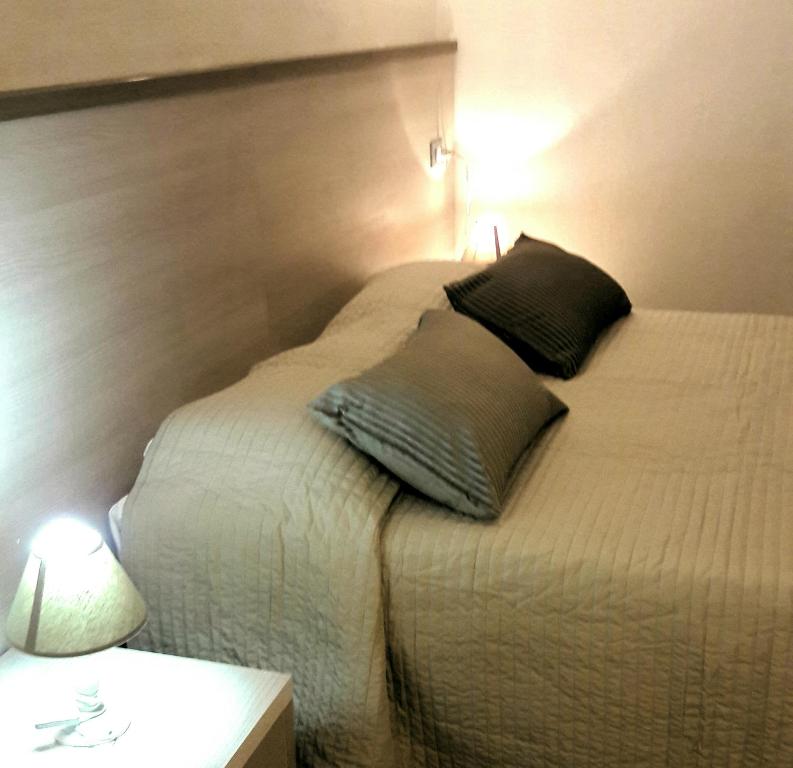 Postel nebo postele na pokoji v ubytování Taverna del Capitano Rooms