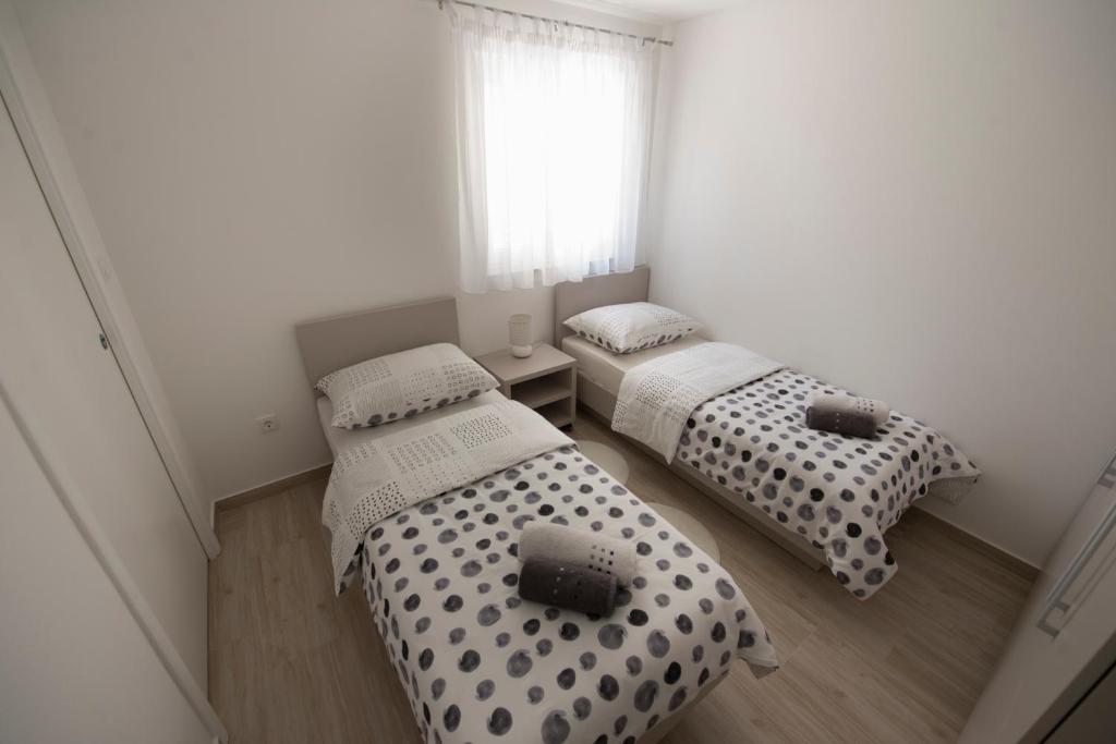 Postel nebo postele na pokoji v ubytování Apartments Bonus and private parking