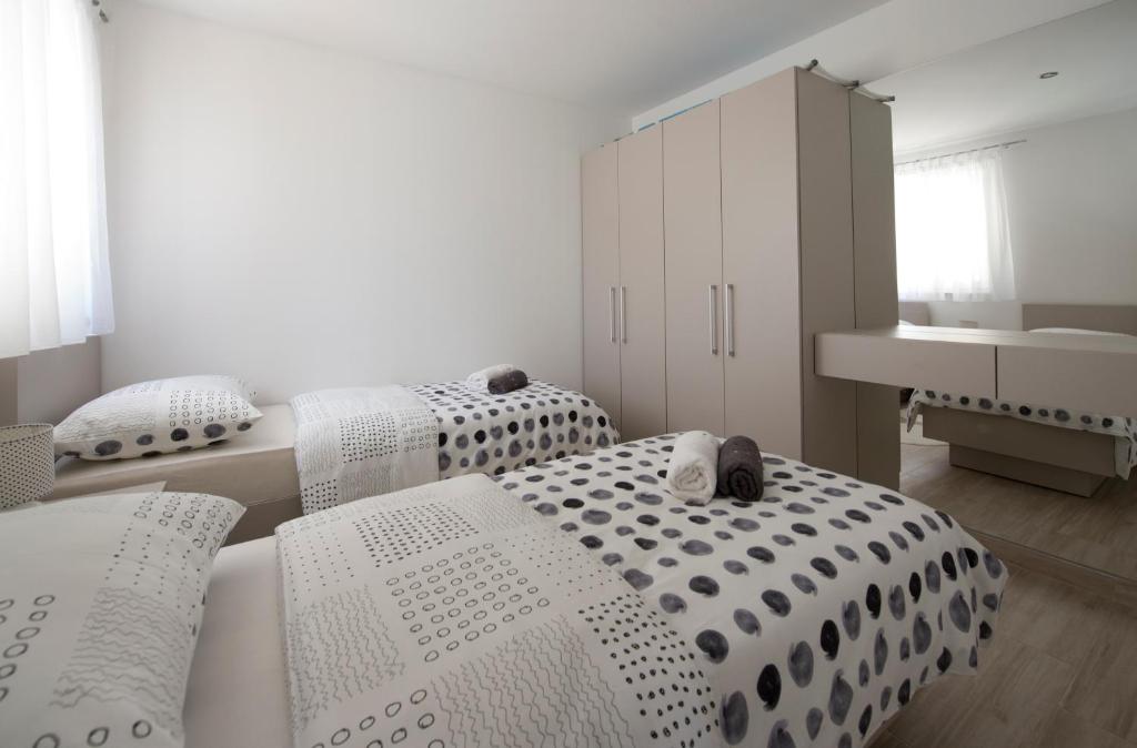 Postel nebo postele na pokoji v ubytování Apartments Bonus and private parking