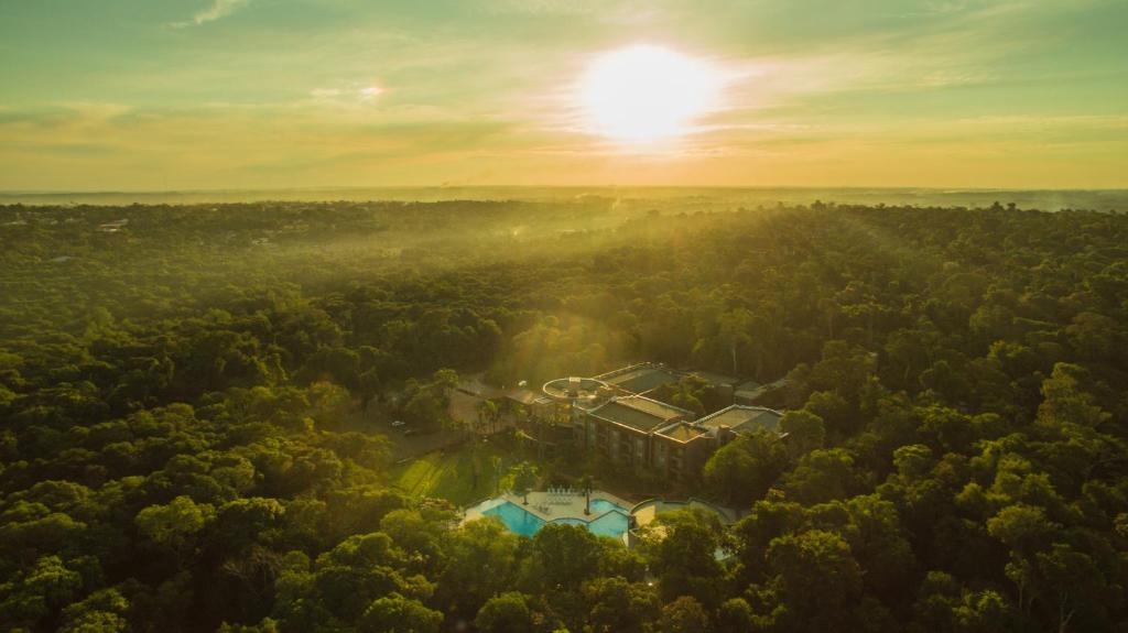 an aerial view of a house in the middle of a forest at Falls Iguazú Hotel & Spa in Puerto Iguazú